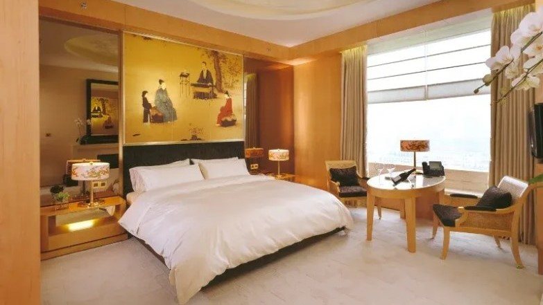 Hotel bedroom with king bed and soft lighting
